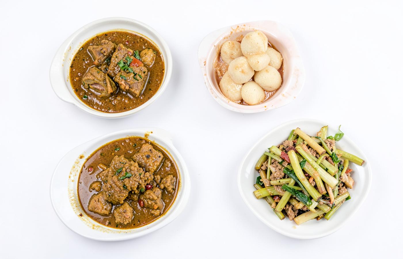 Selection of East Indian dishes on a white background
